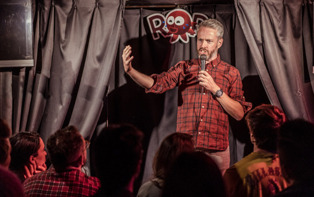 Steven Morgan performing standup comedy in Japan
